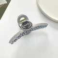 Detail of 11cm blue hair claw clip with round Barrette La France lettered accent - Gray