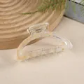 Dettaglio di una molletta per capelli a semicerchio in acrilico con trama ambrata - Stile Incurvato Motivo Ambra / Oro champagne