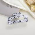 Detail view of large rectangular hair claw with black and white marble ink patterns - Black Crackle