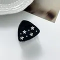 Detail of a black star hair claw clip with silver stars and sparkling rhinestones - Black