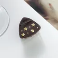 Detail of dark brown star hair claw clip with golden stars and crystals on white background - Dark Coffee