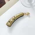 Close-up of acetic banana clip with champagne crystals and clover motif on resin - 10cm / Yellow