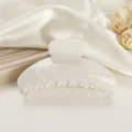 Detailed view of large marble texture hair claw clip on white silk with floral decor - 10cm / Rock White