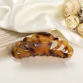 Detail of tortoiseshell patterned hair claw clip on elegant satin and floral backdrop - 10.5cm / Coffee Leopard