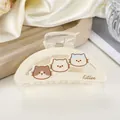 Dettaglio della molletta per capelli crema con motivi di gattini e scritta kitten - Bianco avorio