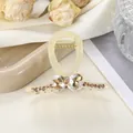 Detail of jelly yellow hair claw clip with champagne rhinestones and crystal hearts - 7cm / Off White