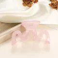 Close-up of a wavy pink jelly claw clip with a sleek matte finish and metal spring detail - 9cm / Light Pink