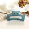 Detail of blue translucent square hair claw clip on soft velvet with petals - 8cm / Teal