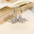 Detail of transparent acrylic hair claw clip with crystal bows and shimmering rhinestones - Gray