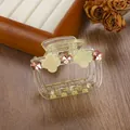 Detail of yellow translucent hair claw clip with clover motifs and star rhinestones - 6.5cm / Green