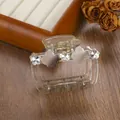 Detail view of champagne hair claw clip with floral rhinestones and opal-style flowers - 6.5cm / Gray