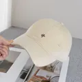 Detailed view of beige cotton canvas baseball cap with distressed rips and embroidered symbol - Adjustable / Khaki