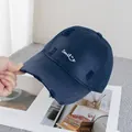 Detailed view of navy blue distressed baseball cap with white Smile embroidery - Adjustable / Navy Blue