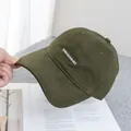Close-up of olive green baseball cap with white KIVEZAH COLOXY letter embroidery - Adjustable / Army Green