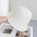 Detail of hollow knit wave pattern on creamy white bucket hat with airy texture - M / Beige