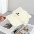 Detail of cream cotton baseball cap with cute cat ears and embroidered letter M logo - Adjustable / Yellow