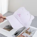 Detail of light purple baseball cap with 3D cat ears and NIU NIU embroidery - Adjustable / Purple