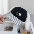 Detail of cute long plush rabbit ears and checkered brim on a black baseball cap - Adjustable / Black