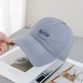 Detail shot of the Backing cursive embroidery on this gray-blue cotton baseball cap - Adjustable / Light Gray