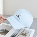 Detail of light blue cotton baseball cap with coffee bean embroidery on curved brim - Adjustable / Blue