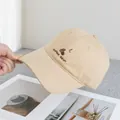 Close-up of beige baseball cap featuring Coffee Bean embroidery and curved brim detail - Adjustable / Khaki