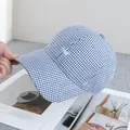 Detailed embroidery on blue and white gingham baseball cap with soft cotton texture - Adjustable / Navy Blue
