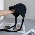 Detail of black crochet bucket hat showing hollow-out knit texture and wavy brim edges - Black / M (56-58cm)