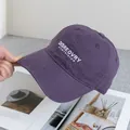 Detail of purple cotton baseball cap featuring white letter embroidery and washed texture - Adjustable / Purple