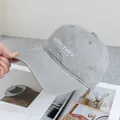 Close-up of light gray washed cotton baseball cap with white 3D letter embroidery - Adjustable / Light Gray