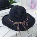 Close-up of black woven straw hat with a slim brown bow detail and wavy sun brim - M(56-58cm) / Black