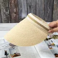 Detail of hand-woven straw visor featuring natural textures and decorative striped ribbon - Adjustable / Beige