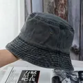 Detailed texture of washed cotton bucket hat featuring side metal ventilation eyelets - M / Black