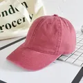 Classic washed cotton baseball cap in vintage brick red with curved brim and six-panel design - Adjustable / Burgundy