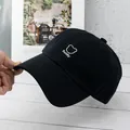Close-up of black cotton baseball cap featuring white Teddy bear head embroidery - Adjustable / Black