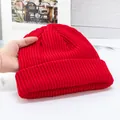 Detailed close-up of a red ribbed knit beanie showing high-quality textured yarn - High Elasticity / Red