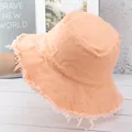 Detail der ausgefransten Kanten an einem aprikosenfarbenen Anglerhut mit Fransenrand - M(56-58cm) / Orange-Rosa