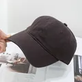 Detail of soft cotton washed baseball cap showing canvas texture and stitching - Adjustable / Black Coffee