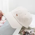 Close-up of cute Corgi dog embroidery on cream white cotton baseball cap details - Adjustable / Beige