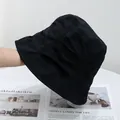 Close-up of black cotton canvas bucket hat showing detailed stitching and fabric texture - Adjustable / Black