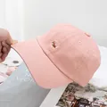 Close-up of cute Corgi dog embroidery on pink cotton baseball cap with neat stitching - Adjustable / Pink