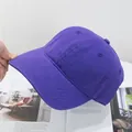 Detail view of purple washed cotton baseball cap featuring reinforced brim stitching - Adjustable / Purple