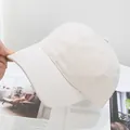 Detailed view of the premium cotton washed baseball cap in a soft cream beige color - Adjustable / Beige