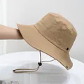 Detail of khaki outdoor bucket hat with adjustable wind cord and metal air vents - Kids (50-54cm) / Khaki