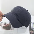 Close-up of dark grey washed cotton baseball cap showing twill fabric and stitching - Adjustable / Dark Gray