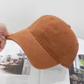 Detail of the reinforced stitching on the brim of a solid cotton baseball cap - Adjustable / Camel