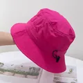 Detail of hot pink bucket hat featuring adjustable black drawstring and reinforced stitching - M / Rose Red