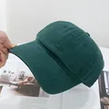 Detail of dark green cotton baseball cap with six-panel construction and curved brim - Adjustable / Dark Green