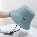 Close-up of lightweight blue sun hat with adjustable windproof cord and side label - One Size / Blue