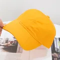 Detailed view of the bright yellow cotton baseball cap with classic stitching - Adjustable / Yellow