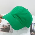 Detailed view of the pure green cotton twill texture and stitching on the baseball cap - Adjustable / Verdant
